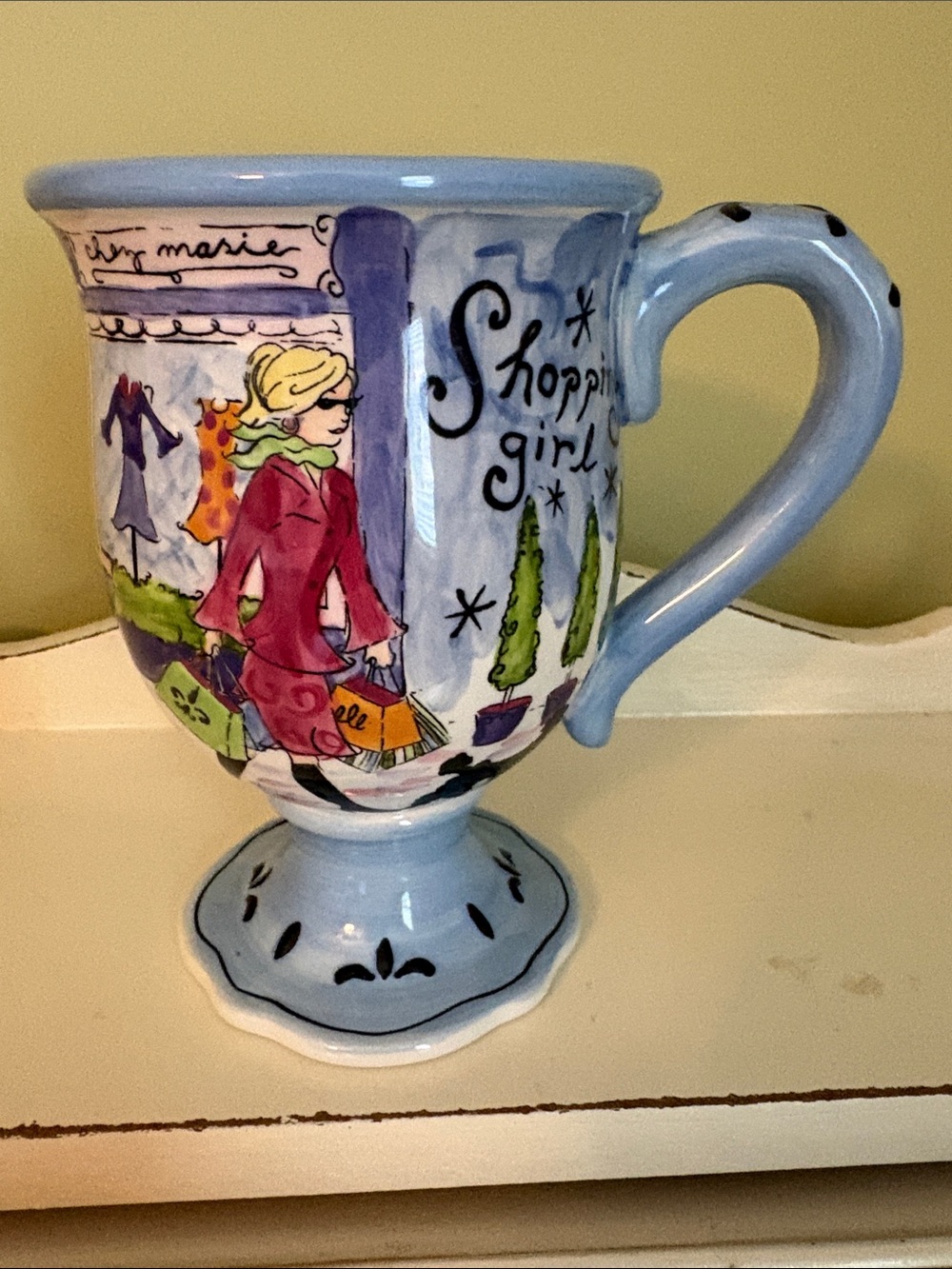 Jennifer Brinkley Shopping Girl Pedestal Ceramic Mug - Light Blue